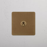Retractive Toggle Switch, Single in Antique Brass on White Background